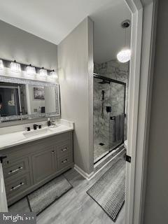 1581 Spring Gate Dr., Unit 5403 McLean, VA 22102 - Photo 10 of 16 a bathroom with a double vanity sink mirror and shower