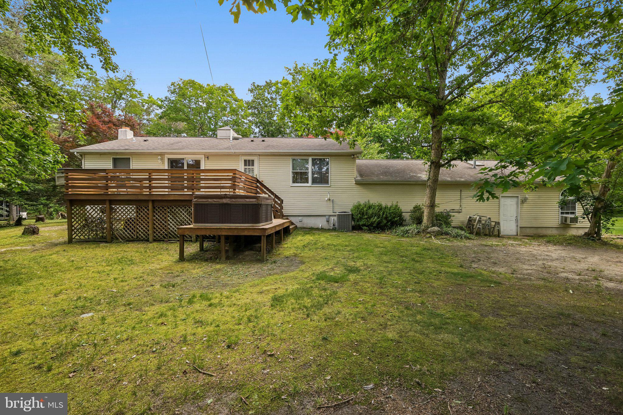 27 Fripps Road Sicklerville, NJ 08081 - Photo 4 of 26 Exterior rear view with deck and hot tub