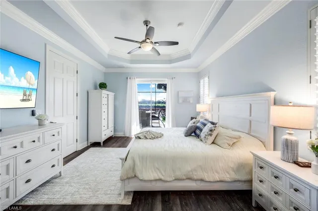 a bedroom with a large bed and a dresser