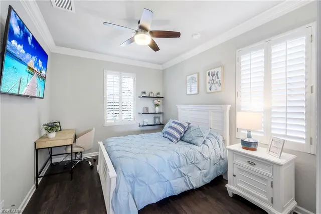 a bedroom with a bed and a table in it