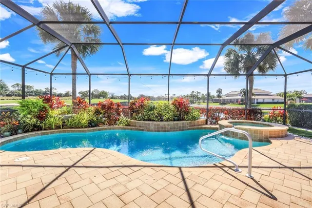a view of a swimming pool with a patio
