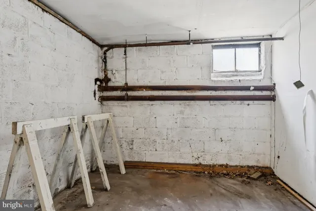 a bathroom with a window and a shower
