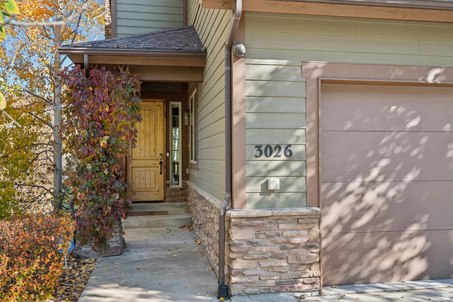 3026 Lower Saddleback Road Park City, UT 84098 - Photo 49 of 71 Property entrance featuring a garage, stone siding, and a shingled roof