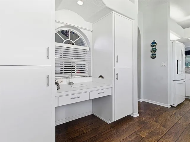 a room with a bench and a window