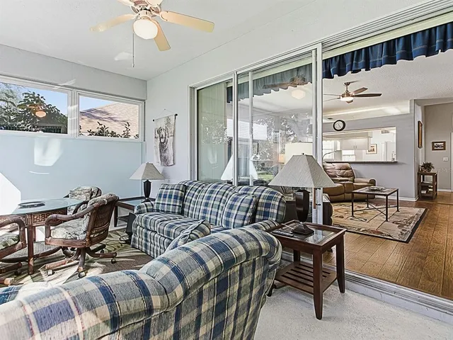 a bedroom with furniture a bed and a chandelier