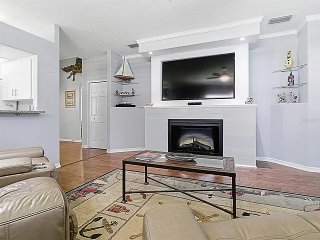 a living room with furniture and a fireplace