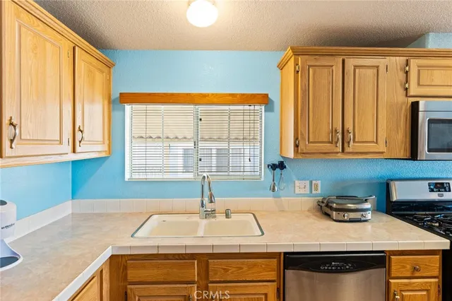 a kitchen with a sink and a window