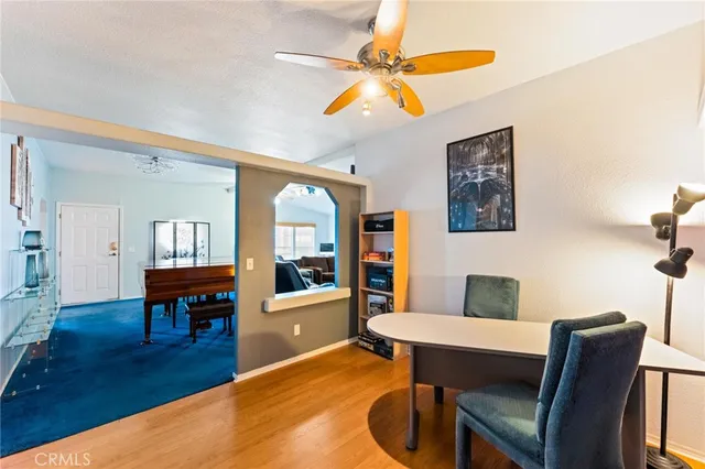 a workspace with furniture and wooden floor