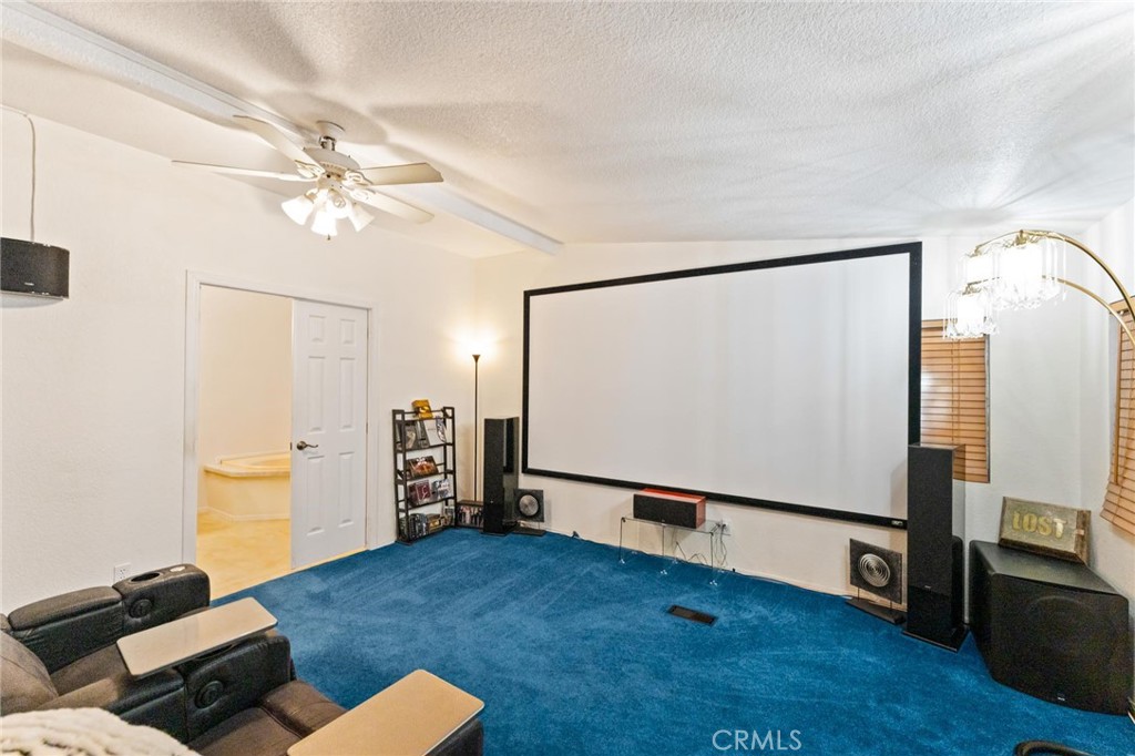 23301 Ridge Rte Drive, Unit 165 Laguna Hills, CA 92653 - Photo 19 of 31 a living room with furniture and a flat screen tv