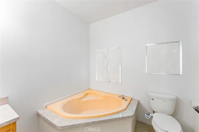 a bathroom with a toilet and a sink