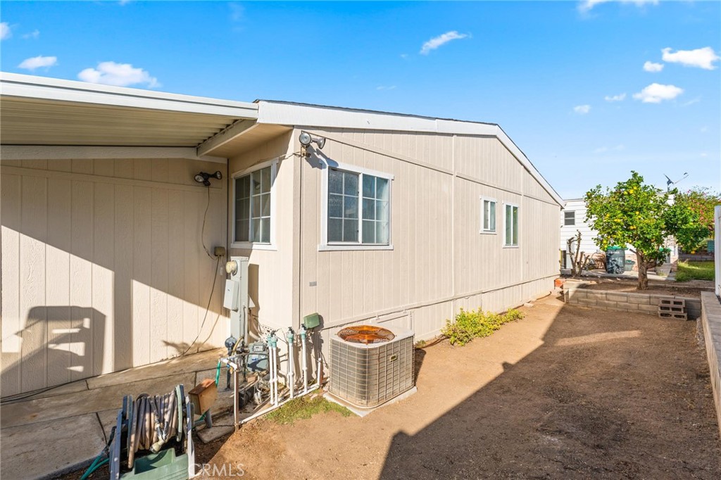 23301 Ridge Rte Drive, Unit 165 Laguna Hills, CA 92653 - Photo 26 of 31 a view of a patio with table and chairs and potted plants
