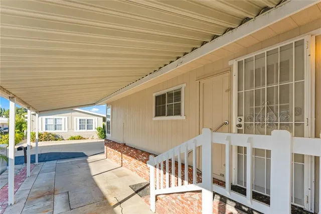 a view of a porch with furniture