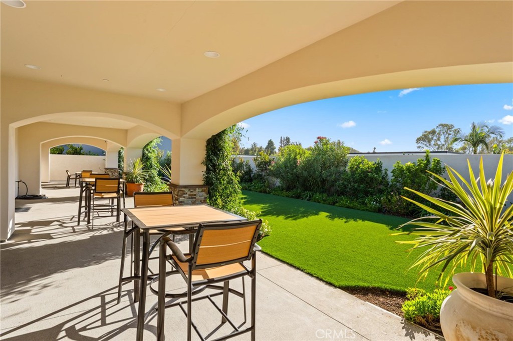 23301 Ridge Rte Drive, Unit 165 Laguna Hills, CA 92653 - Photo 29 of 31 a view of a chairs and table in patio