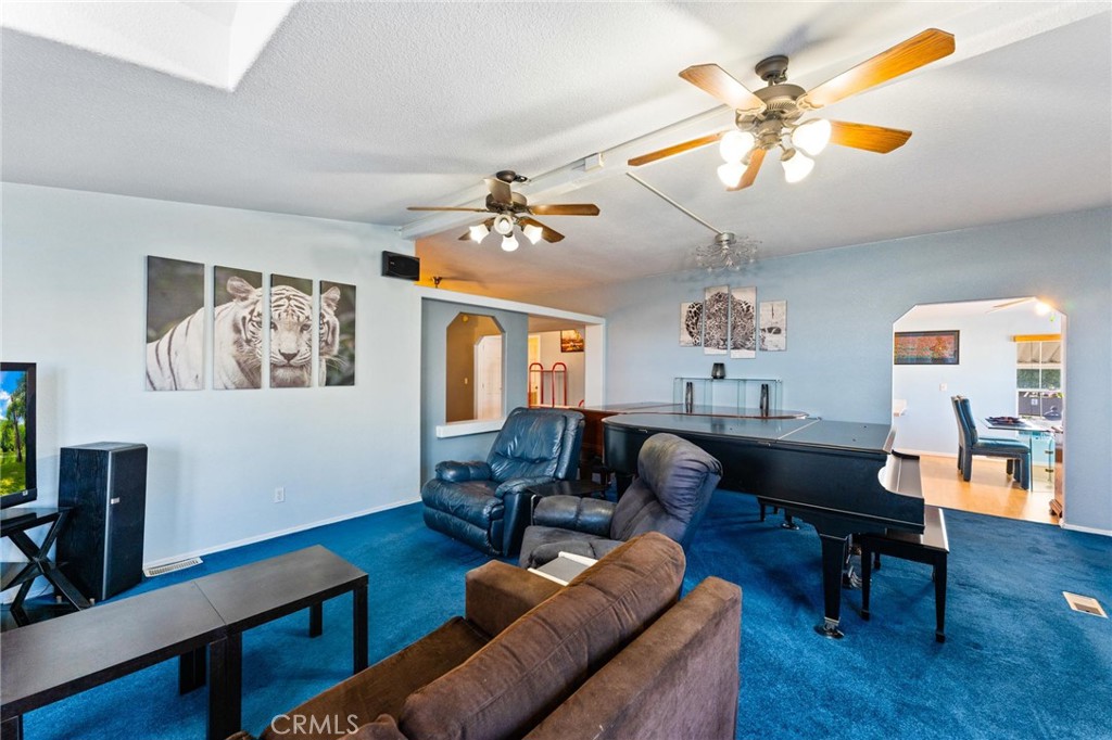 23301 Ridge Rte Drive, Unit 165 Laguna Hills, CA 92653 - Photo 6 of 31 a living room with furniture and wooden floor