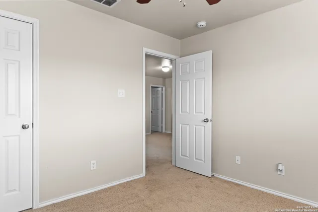 an empty room with closet area
