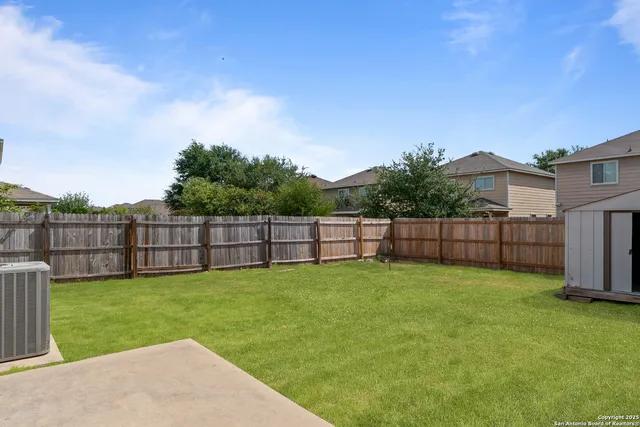 a view of a backyard with a small cabin