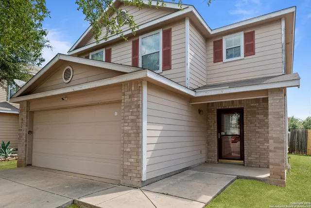 a view of a house with a garage