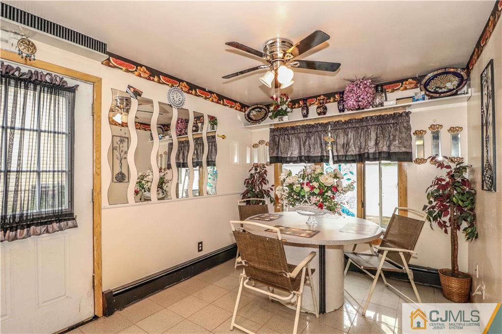 99 Ashley Road Edison, NJ 08817 - Photo 11 of 38 a view of a dining room with furniture and chandelier