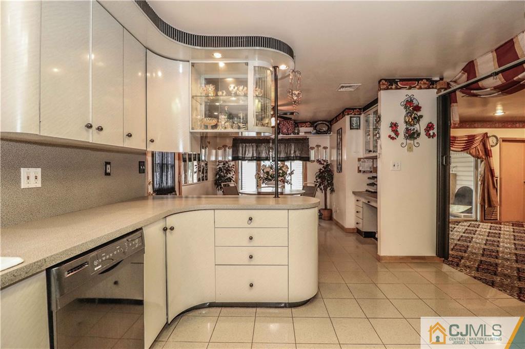 99 Ashley Road Edison, NJ 08817 - Photo 14 of 38 a kitchen with cabinets and window