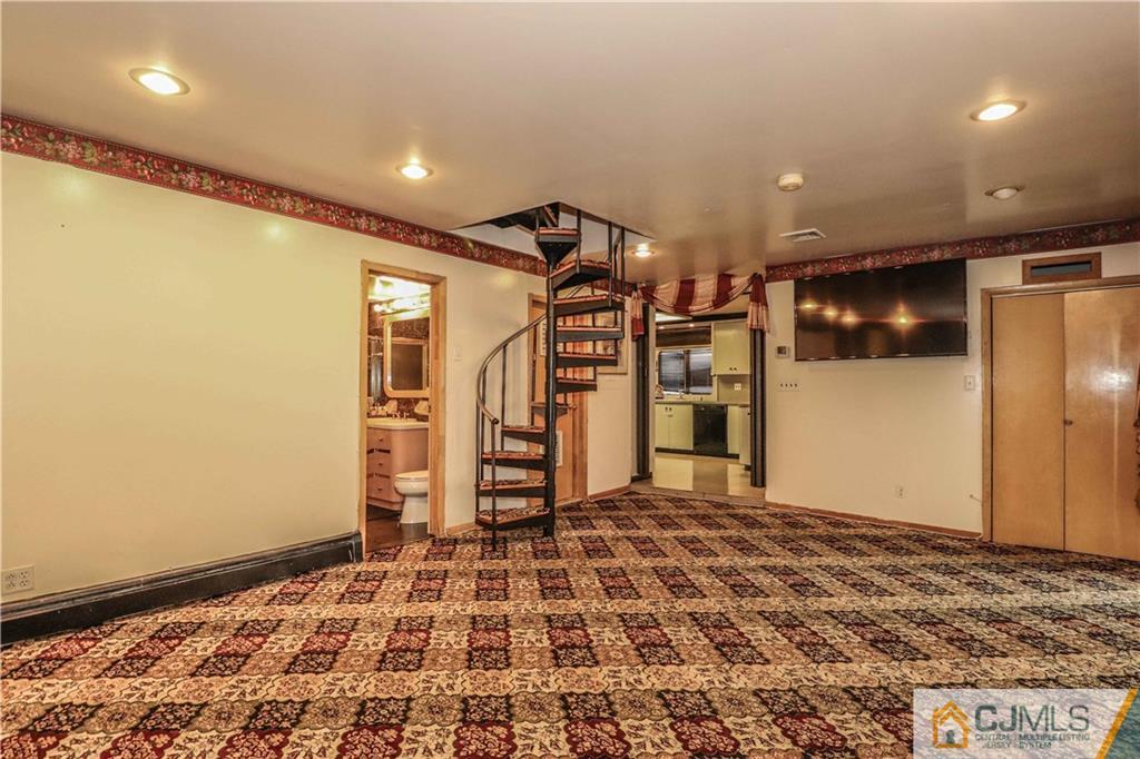 99 Ashley Road Edison, NJ 08817 - Photo 17 of 38 a view of a livingroom with a staircase