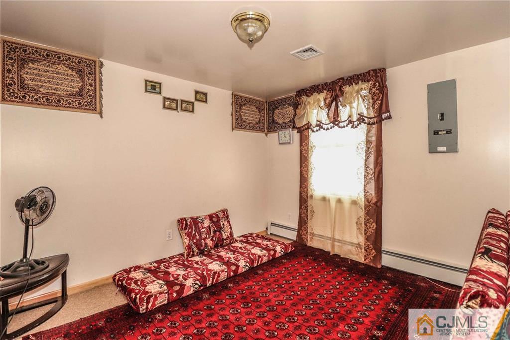 99 Ashley Road Edison, NJ 08817 - Photo 20 of 38 a bedroom with a bed and a window