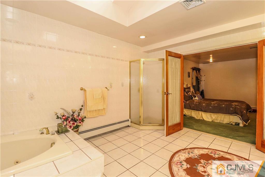 99 Ashley Road Edison, NJ 08817 - Photo 24 of 38 a spacious bathroom with a tub and shower