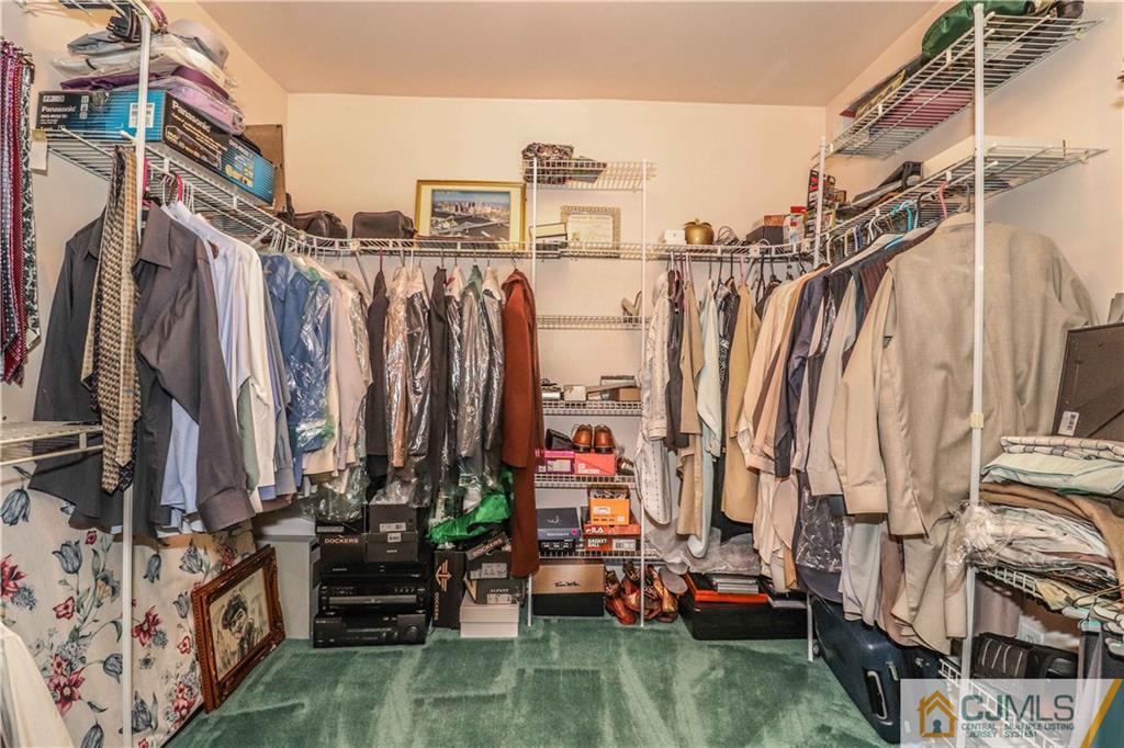 99 Ashley Road Edison, NJ 08817 - Photo 26 of 38 a view of walk in closet with large trees