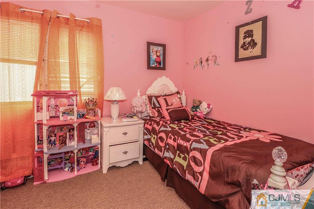 99 Ashley Road Edison, NJ 08817 - Photo 28 of 38 a bedroom with a bed and a window
