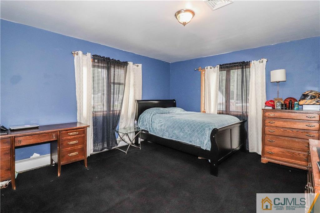 99 Ashley Road Edison, NJ 08817 - Photo 30 of 38 a bedroom with a bed and a window