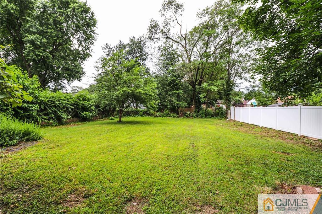 99 Ashley Road Edison, NJ 08817 - Photo 37 of 38 a view of a yard with a house