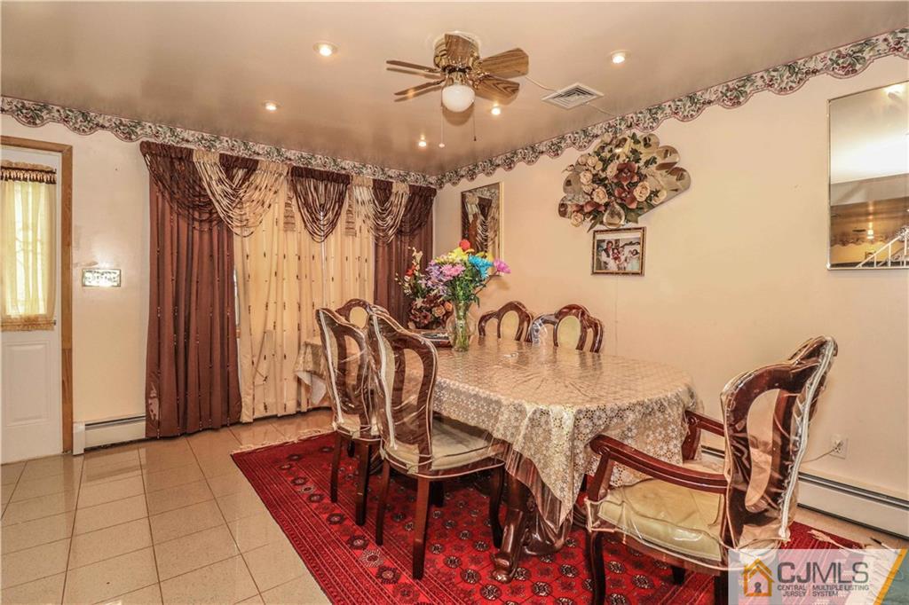 99 Ashley Road Edison, NJ 08817 - Photo 9 of 38 a view of a dining room with furniture and chandelier