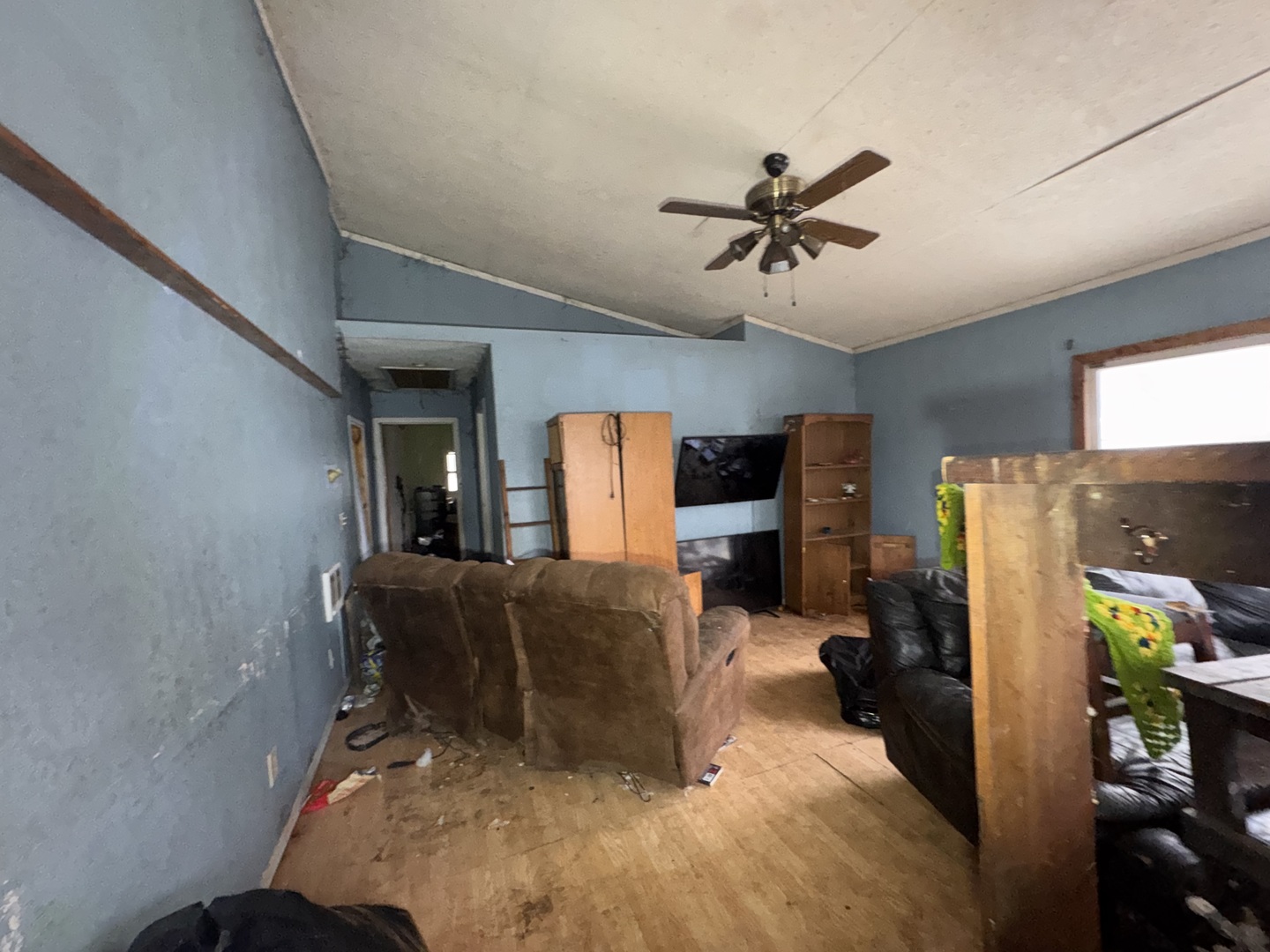 161 Wilbern Road Washburn, IL 61570 - Photo 4 of 7 a bed room with furniture and a ceiling fan