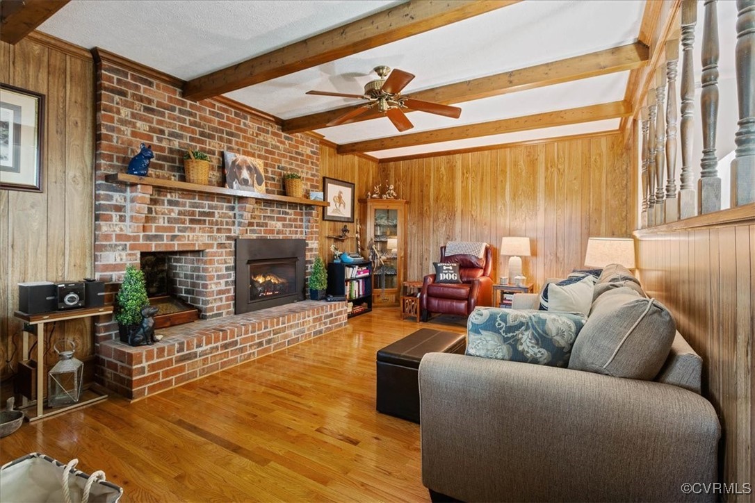 9531 Jerusalem Plank Road Waverly, VA 23890 - Photo 8 of 44 Living room featuring a fireplace, ceiling fan, be
