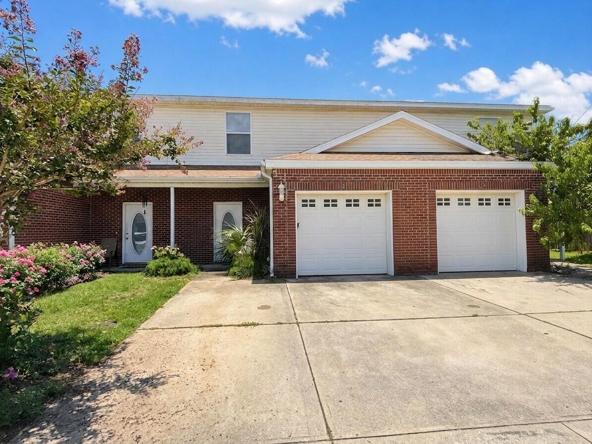 1014 Airport Road, Unit 121 Destin, FL 32541 - Photo 2 of 24 01-exterior_front_of_house_1