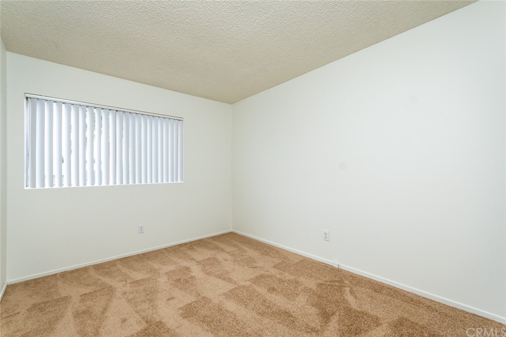 8865 Independence Avenue, Unit 26 Canoga Park, CA 91304 - Photo 16 of 40 an empty room with a window