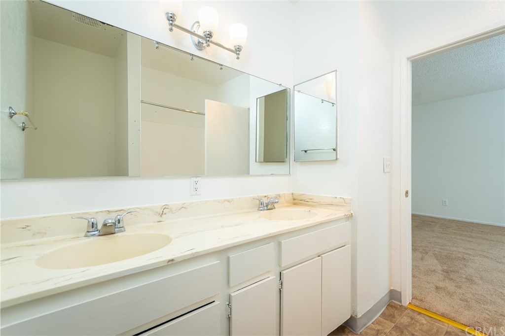 8865 Independence Avenue, Unit 26 Canoga Park, CA 91304 - Photo 27 of 40 a bathroom with a sink and a mirror