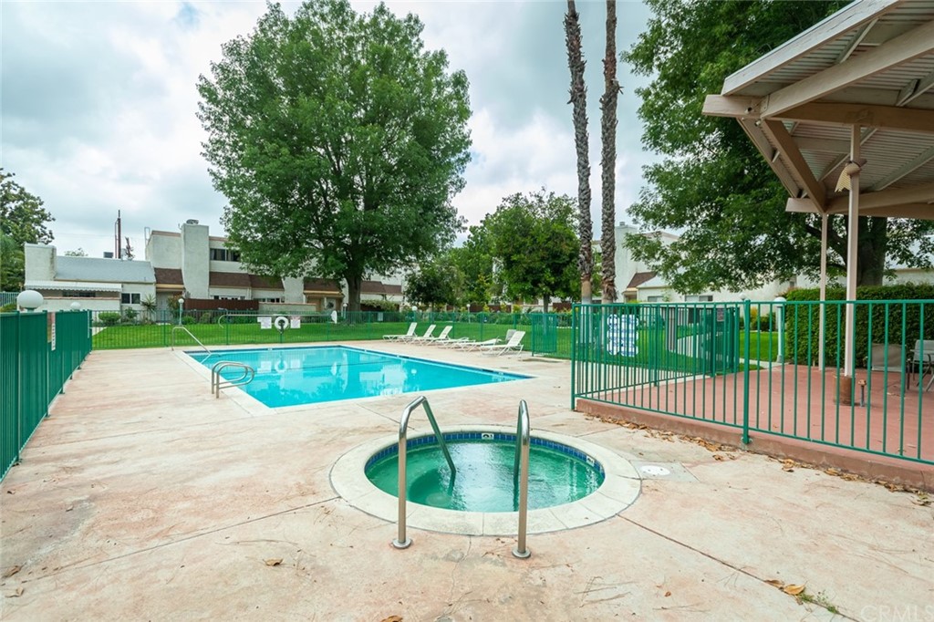 8865 Independence Avenue, Unit 26 Canoga Park, CA 91304 - Photo 36 of 40 a swimming pool with yard and outdoor seating