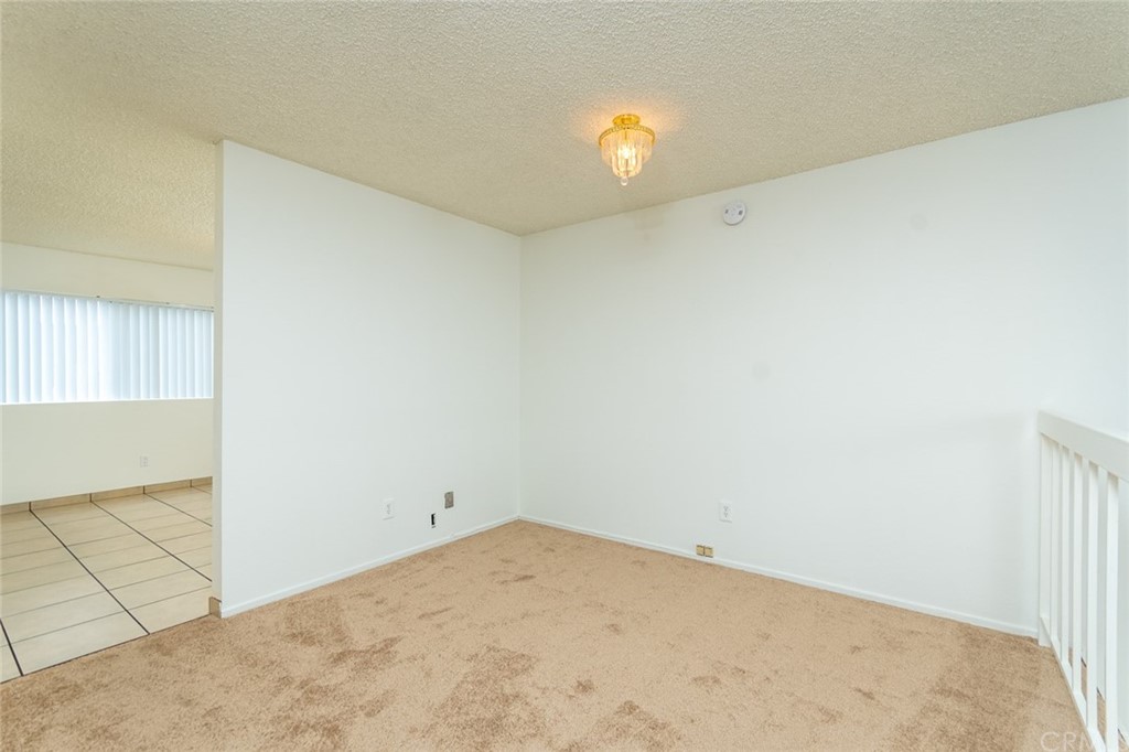 8865 Independence Avenue, Unit 26 Canoga Park, CA 91304 - Photo 6 of 40 an empty room with windows