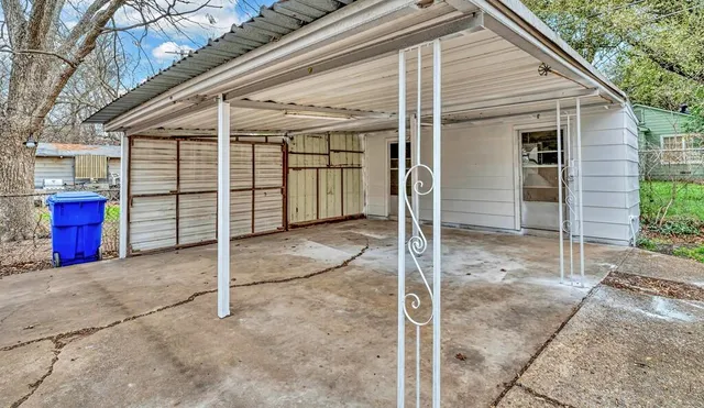 a view of a house with a backyard and porch