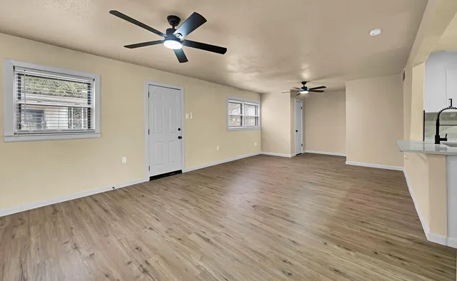 a view of an empty room with a window