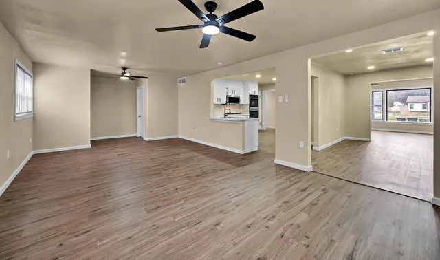 a view of a livingroom with a kitchen