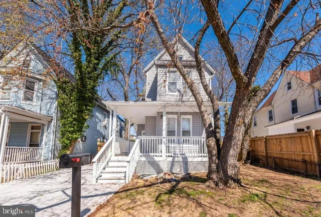 a house with trees in front of it
