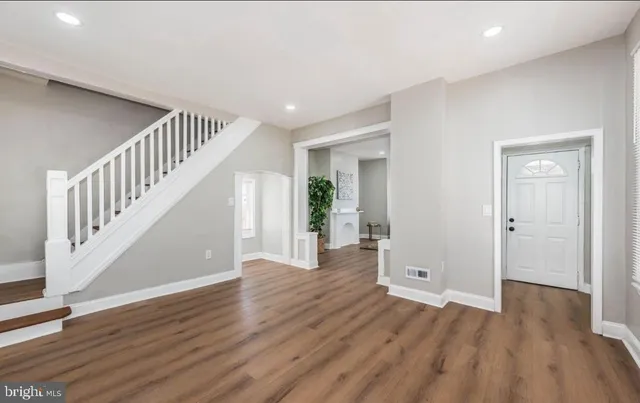 a view of entryway with wooden floor