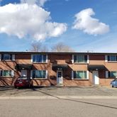 a view of a car park in front of house