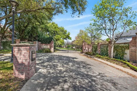 a view of a street with trees on both side of it