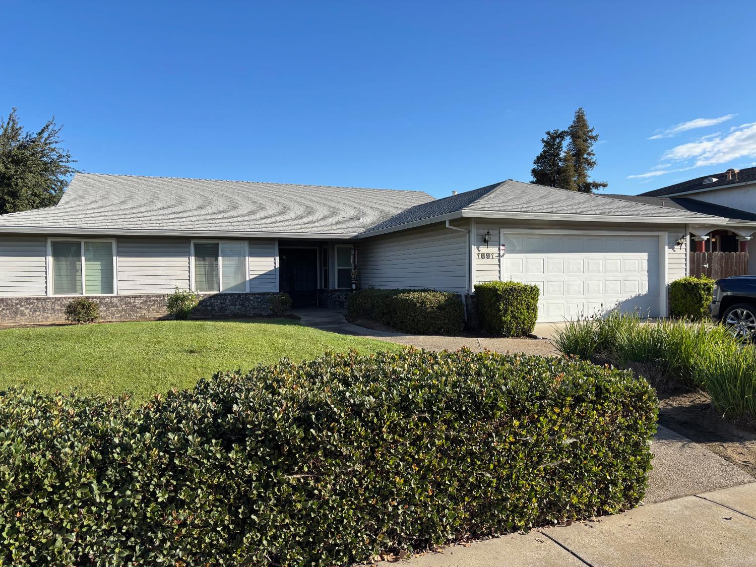 a front view of a house with a yard