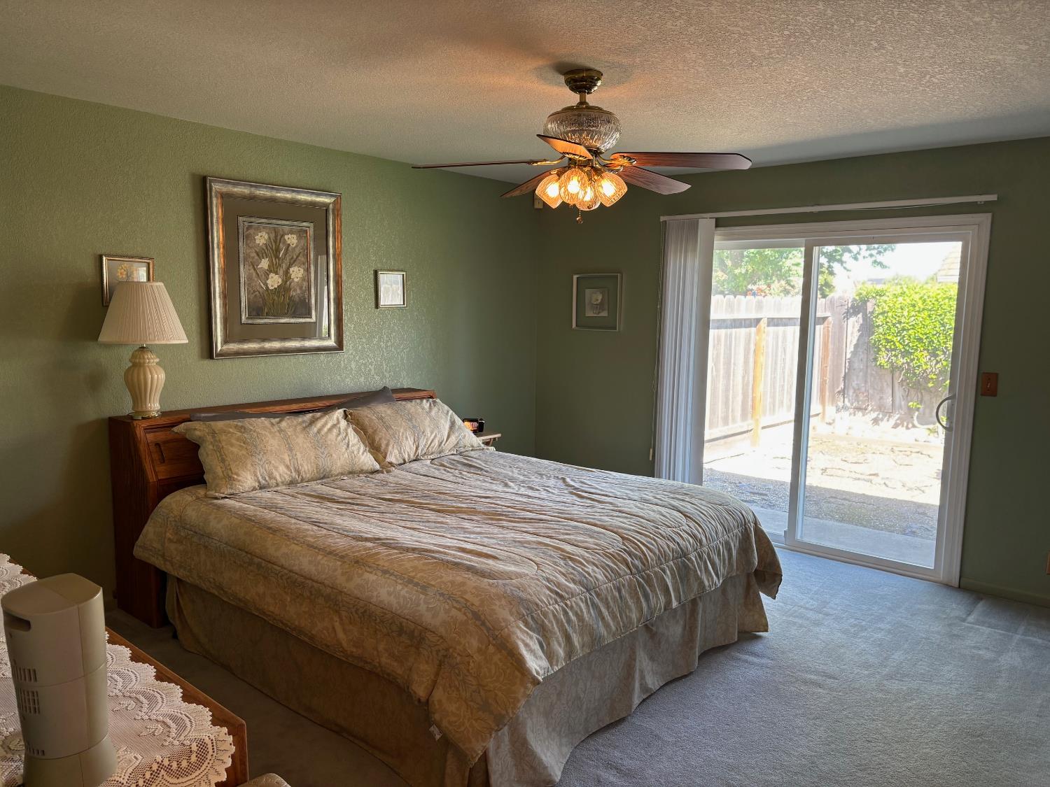 1691 Davis Street Ripon, CA 95366 - Photo 13 of 22 a bedroom with a large bed and a window