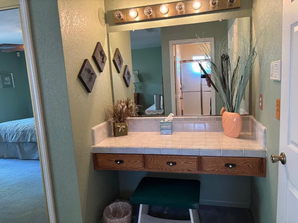 a bathroom with a sink and a mirror