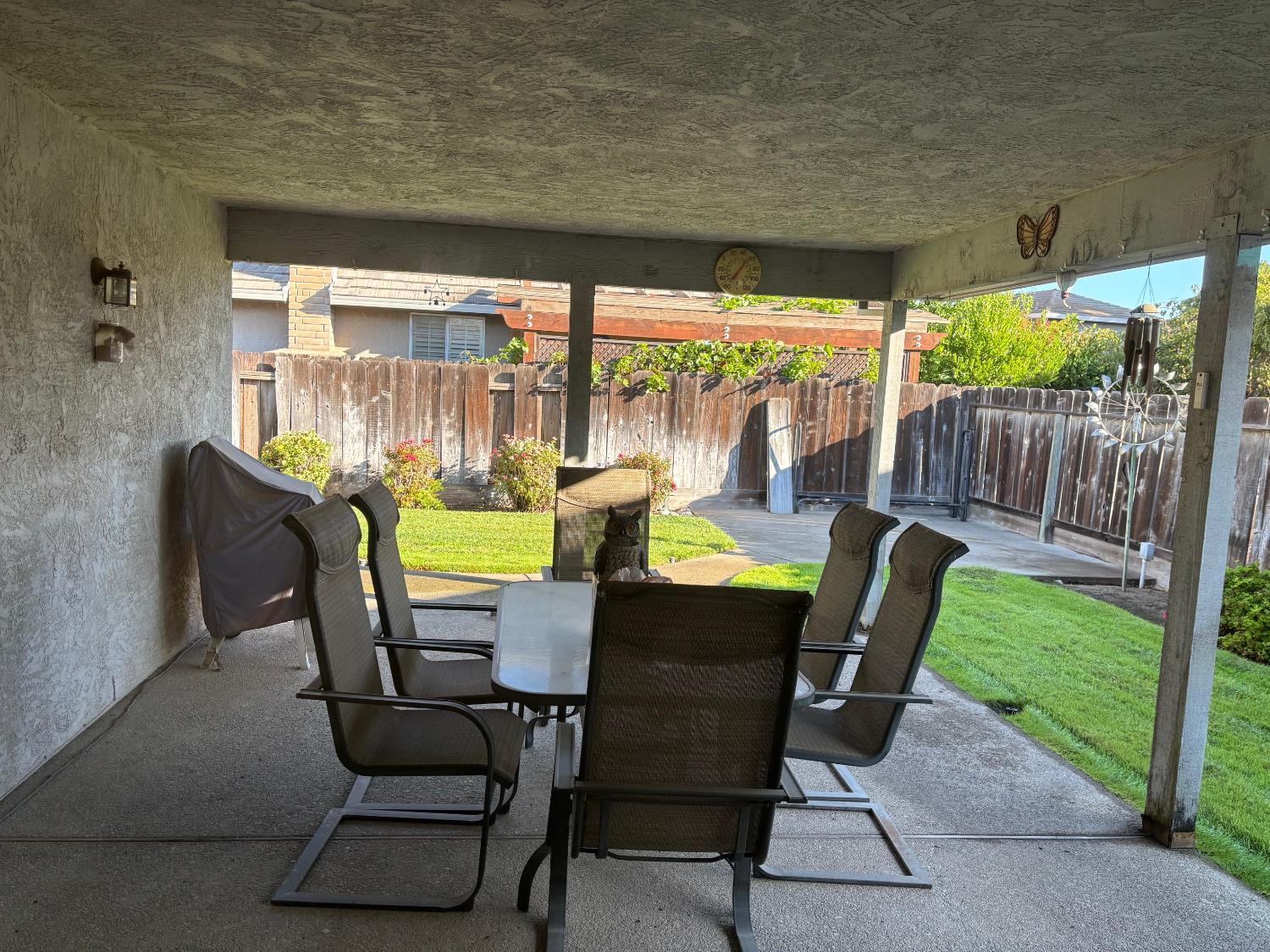 1691 Davis Street Ripon, CA 95366 - Photo 18 of 22 a view of a porch with furniture and garden