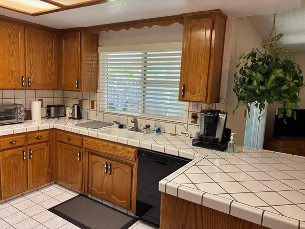 a kitchen with a sink and cabinets